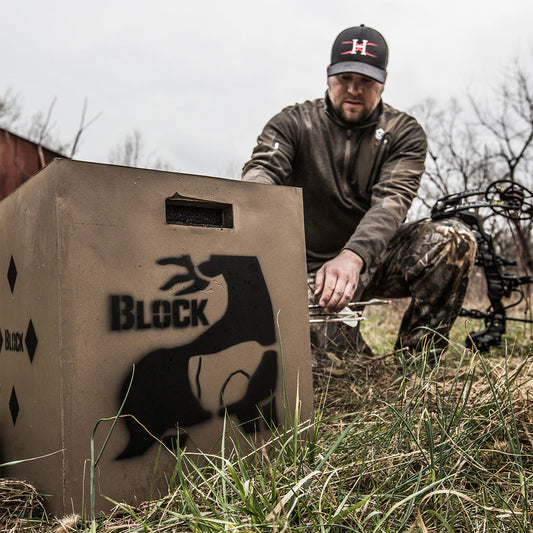 Camouflage bowhunting equipment used in outdoor archery hunting.