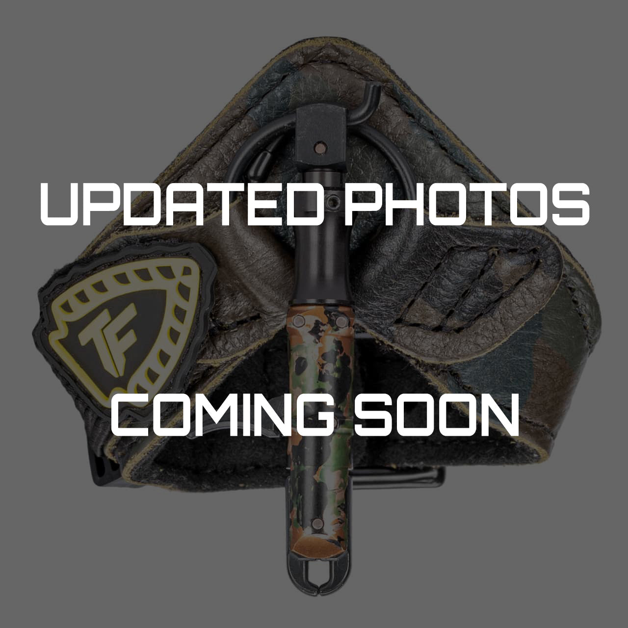 Camouflage arrow rest with bowhunting accessories, ready for outdoor archery.