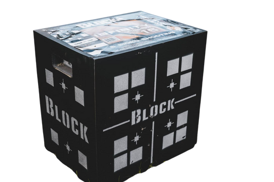 Target practice box for outdoor shooting, black with white graphics on grassy terrain.