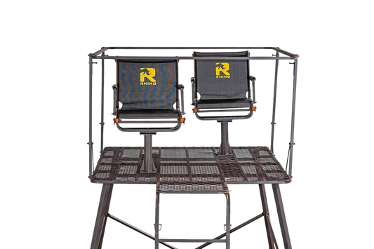 Dual hunting chairs mounted on a sturdy platform with a protective frame, ideal for outdoor archery and bowhunting.