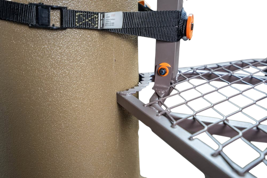 Adjustable mounting bracket for outdoor equipment, attached to a textured surface.