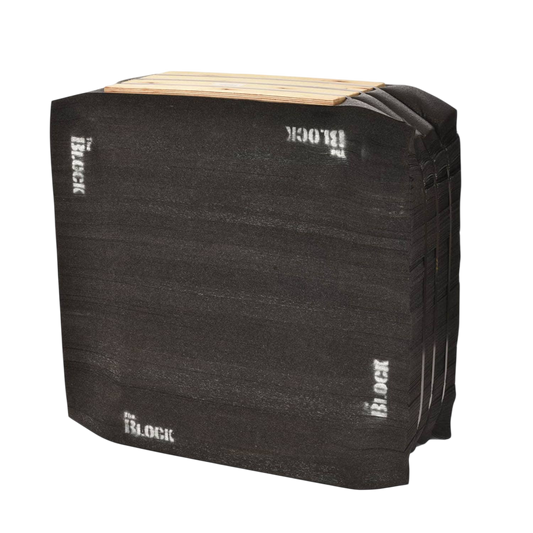 Black archery target foam block for bowhunting practice and training outdoors.
