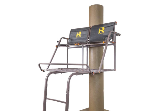 Elevated deer stand with safety features and logo, mounted on a pole for hunting convenience.