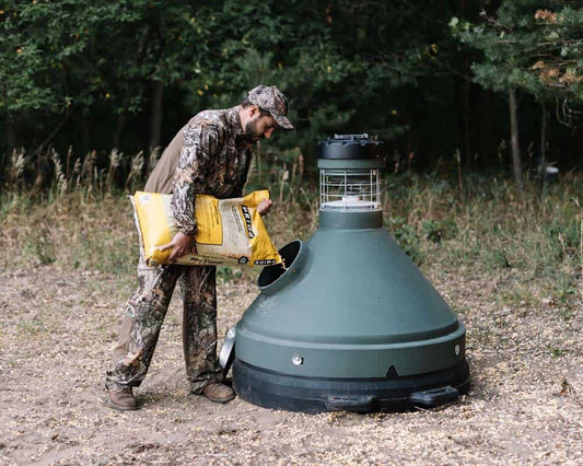 1. Portable bug zapper trap in outdoor woodland setting for hunting or camping safety.