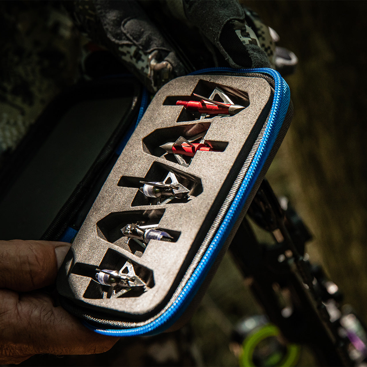 Precision broadhead tips in a foam insert case for archery and bowhunting gear.