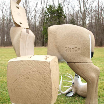 Carved wooden animal targets and blocks outdoors for archery practice at FeraDyne Outdoors.