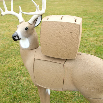 Deer-shaped target with adjustable wooden blocks for archery practice, outdoors on green grass.