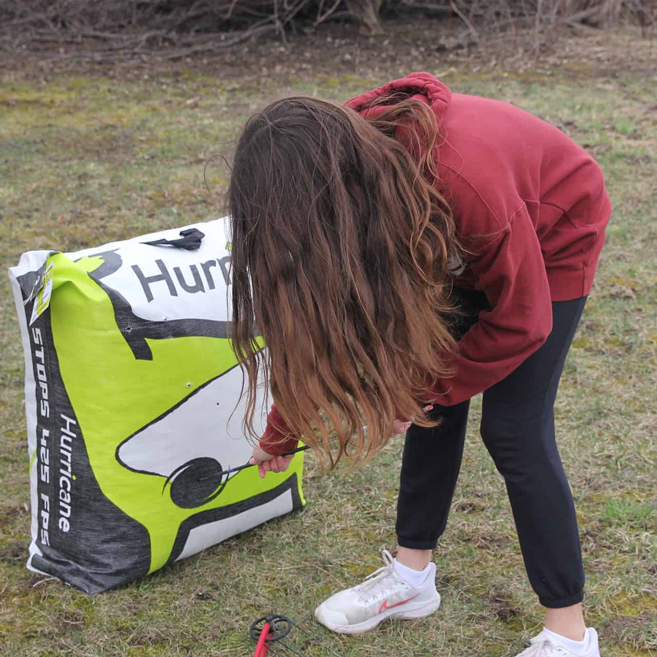 Bright yellow and black archery target bag for outdoor bowhunting practice and training.