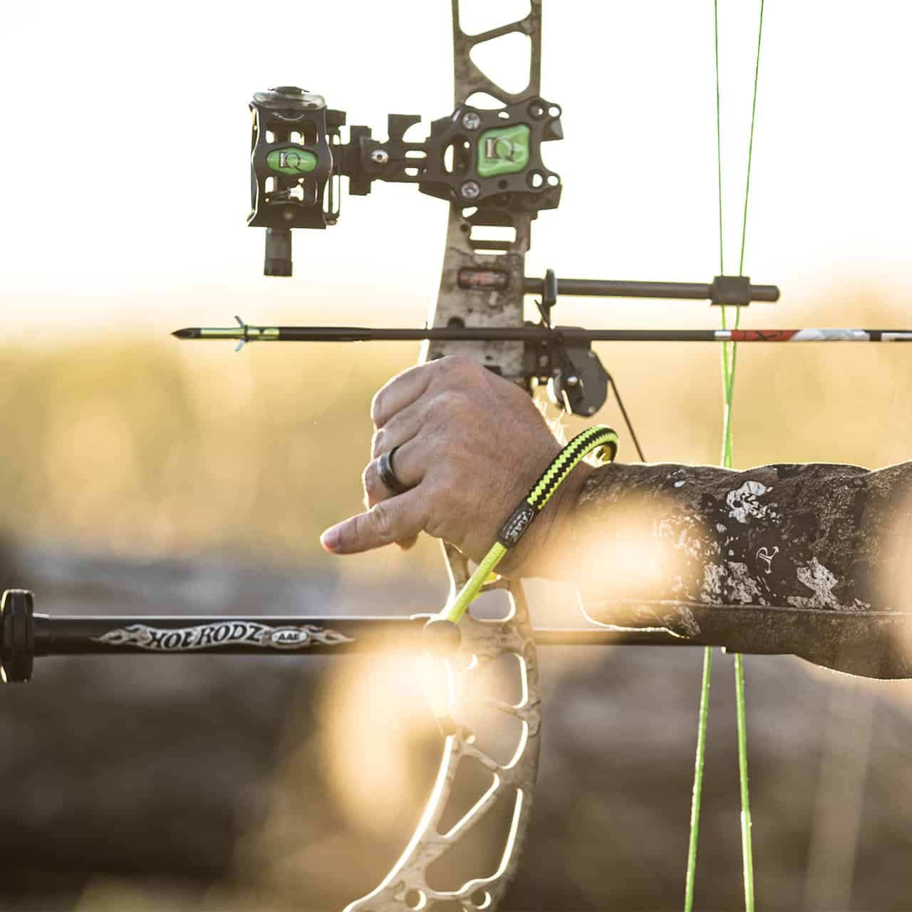 Precision archery bow with quiver and sights ready for outdoor hunting.