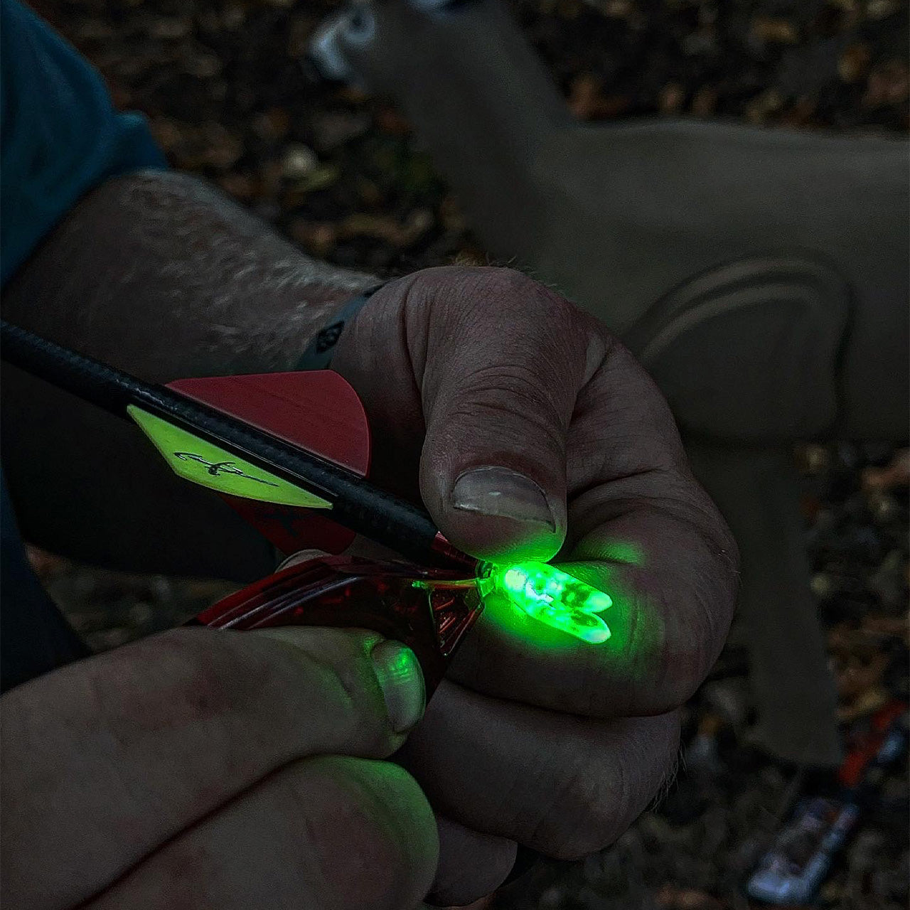 Lighted arrow tip for archery, designed for improved visibility during dusk or dawn hunting.