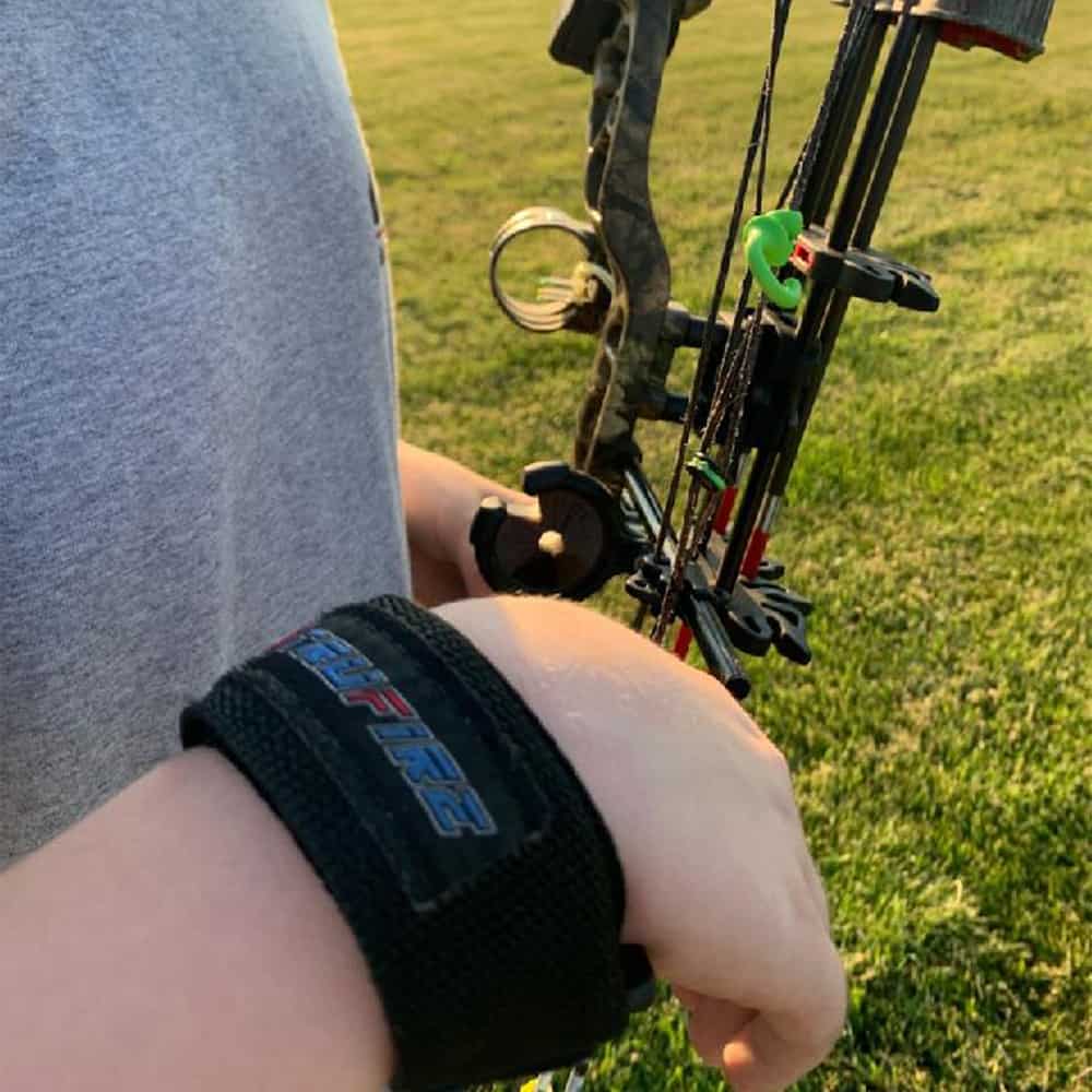 High-quality archery bow with stabilizers and accessories, ready for outdoor hunting or practice.