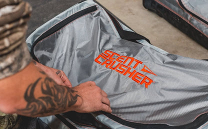 Ventilated bow case with orange "Scent Crusher" logo for outdoor archery use.
