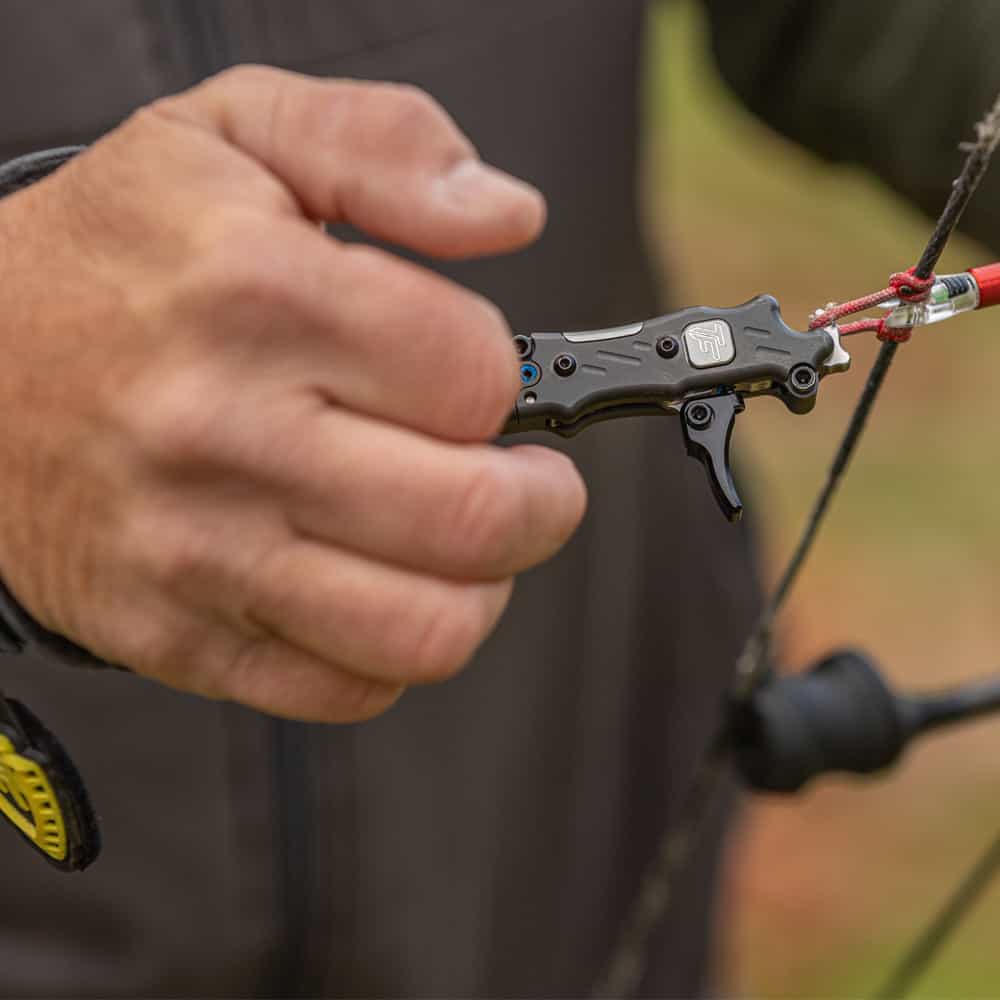 Compact bow release aid used for precision archery and bowhunting.
