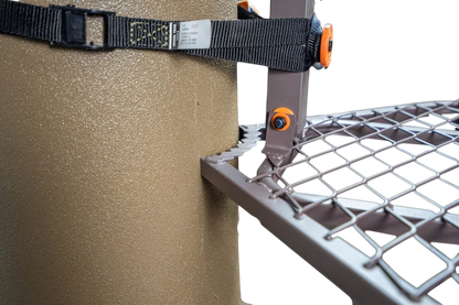 Heavy-duty climbing tree stand mounting bracket with safety strap, outdoor hunting gear.