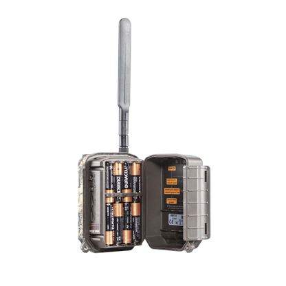 1. Wireless trail camera with antenna, battery compartment, and signal indicator.