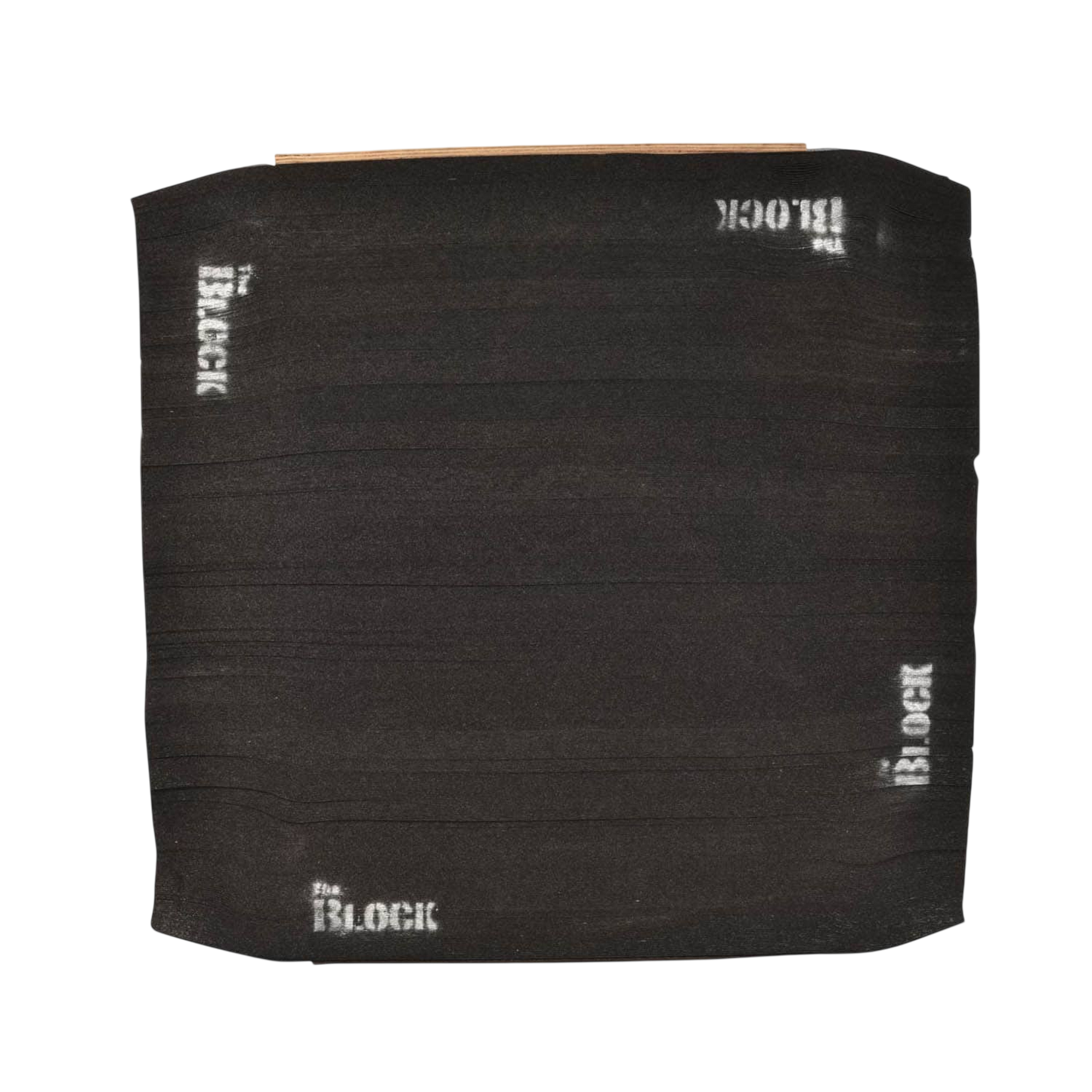 Black archery target block with white "Block" logos and textured surface for bowhunting practice.