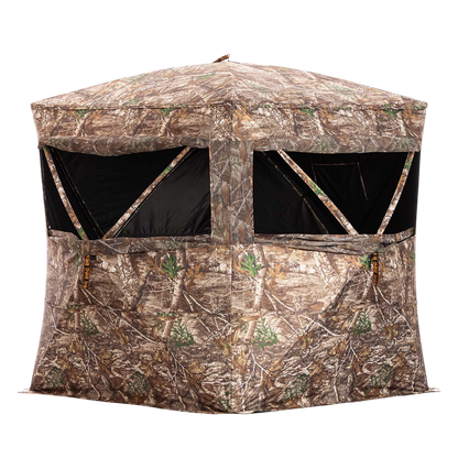 Camouflage hunting blind with mesh windows and fabric walls for outdoor bowhunting.