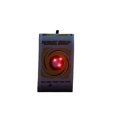 Red laser target with illuminated dots on a dark background, used for archery practice.