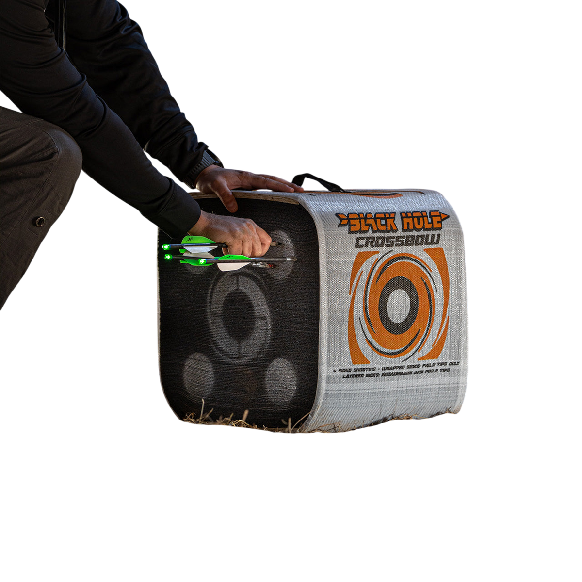 1. Archery target with illuminated arrows set inside a barn for indoor practice.