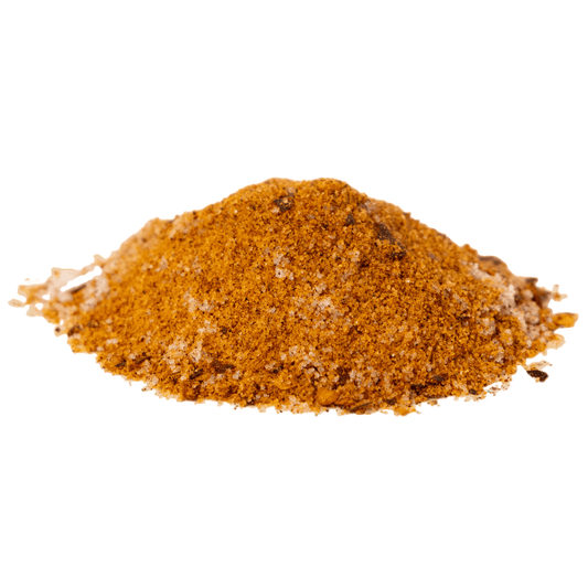 Ground cinnamon spice on a green background.