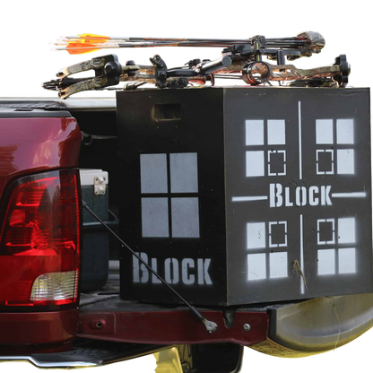 Crossbow and archery gear loaded in truck bed with a Block target for archery practice.