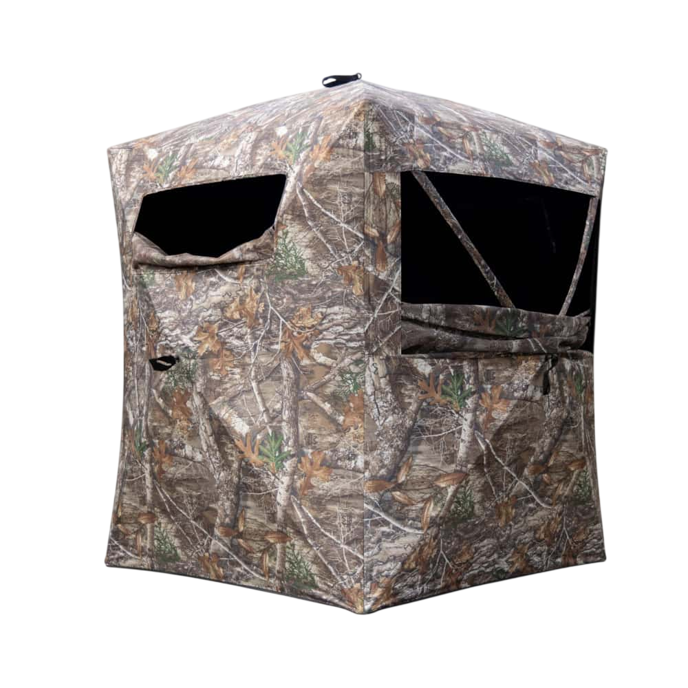 Camouflage hunting blind for archery and bowhunting, designed for concealment in natural terrain.