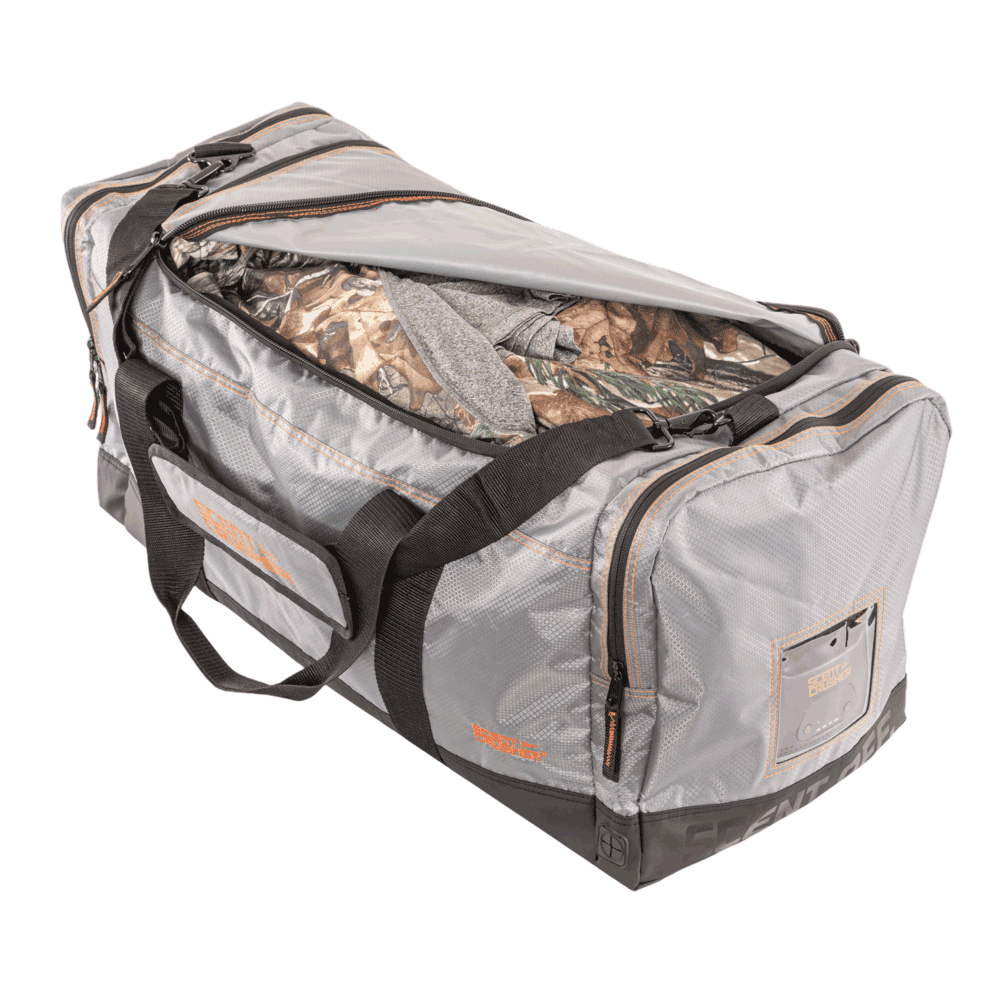 Durable archery gear bag with camouflage clothing for hunting trips.