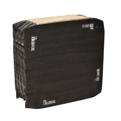 Black foam archery target block with wooden backer for bowhunting practice.