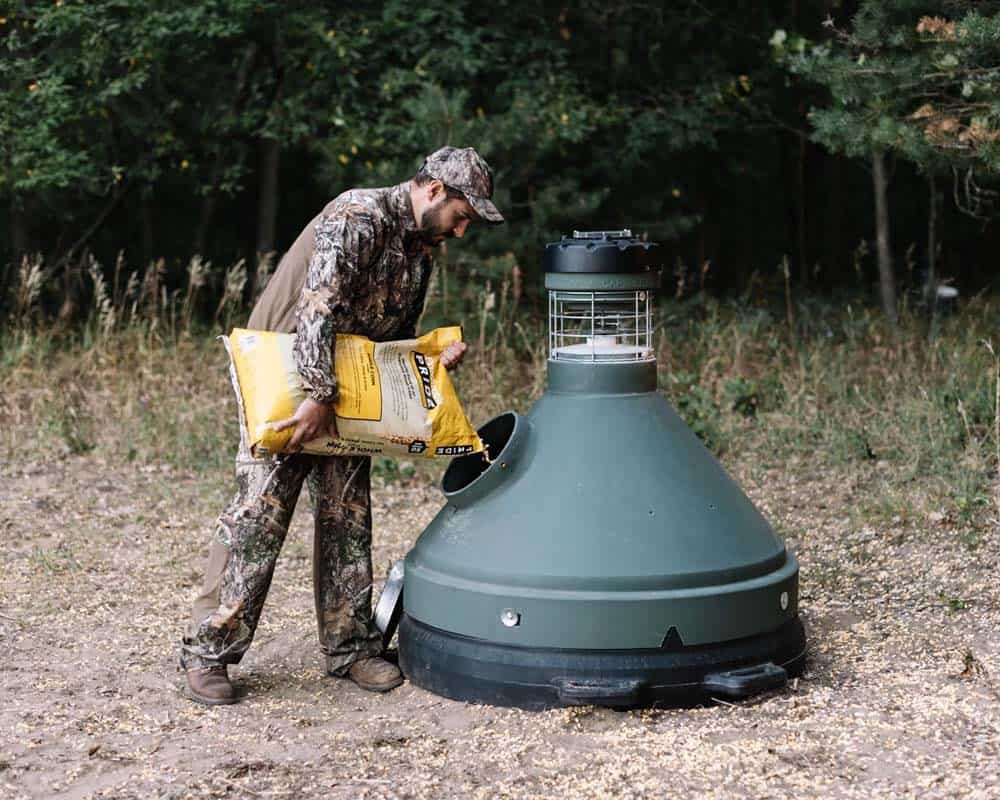 1. Portable bug zapper trap in outdoor woodland setting for hunting or camping safety.