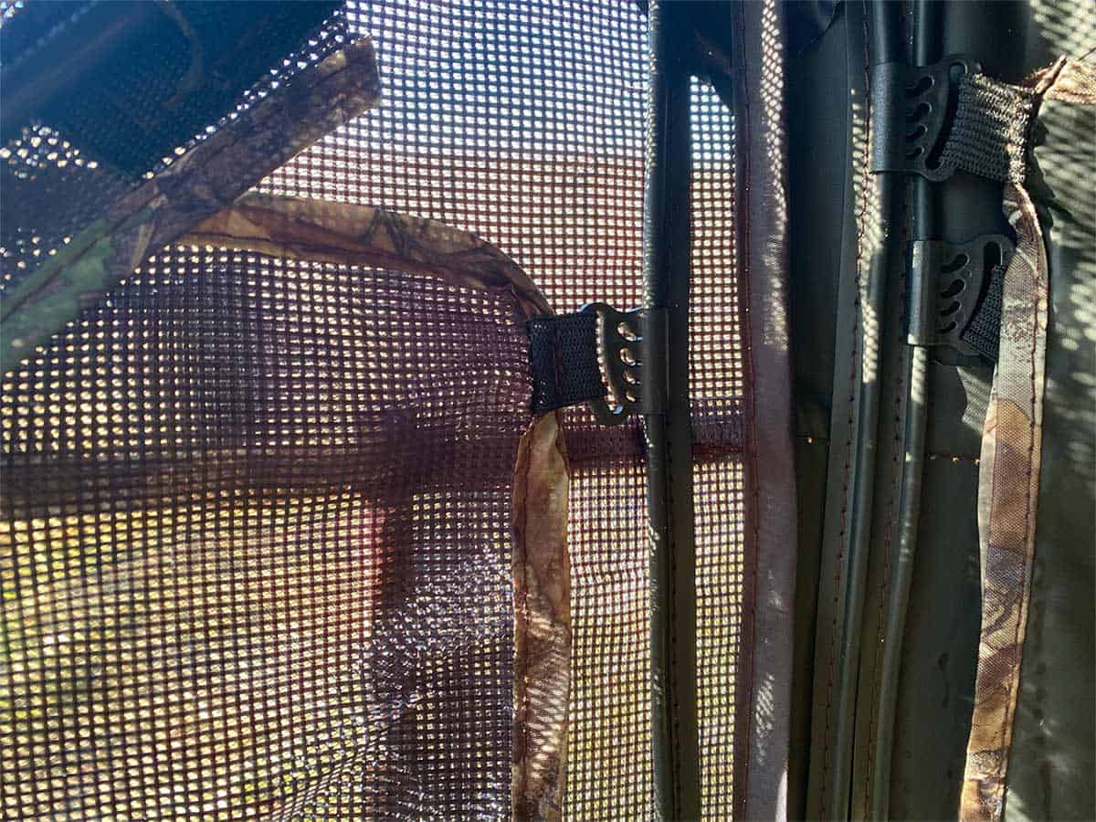 Mesh screen mesh with zippered window for hunting blinds or tree stands.