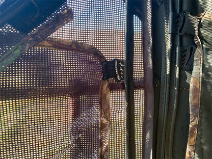 Mesh screen mesh with zippered window for hunting blinds or tree stands.